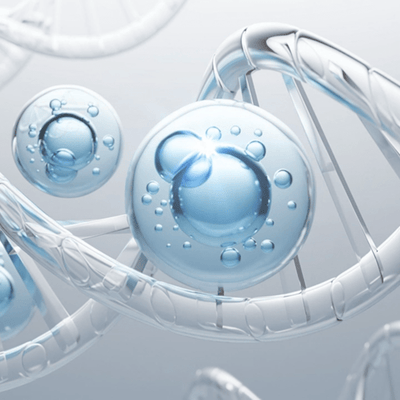 Close-up of water droplets on a clear surface with a light gray background