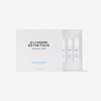 D'lumiere Esthetique skincare set with bottles in a box on a white background