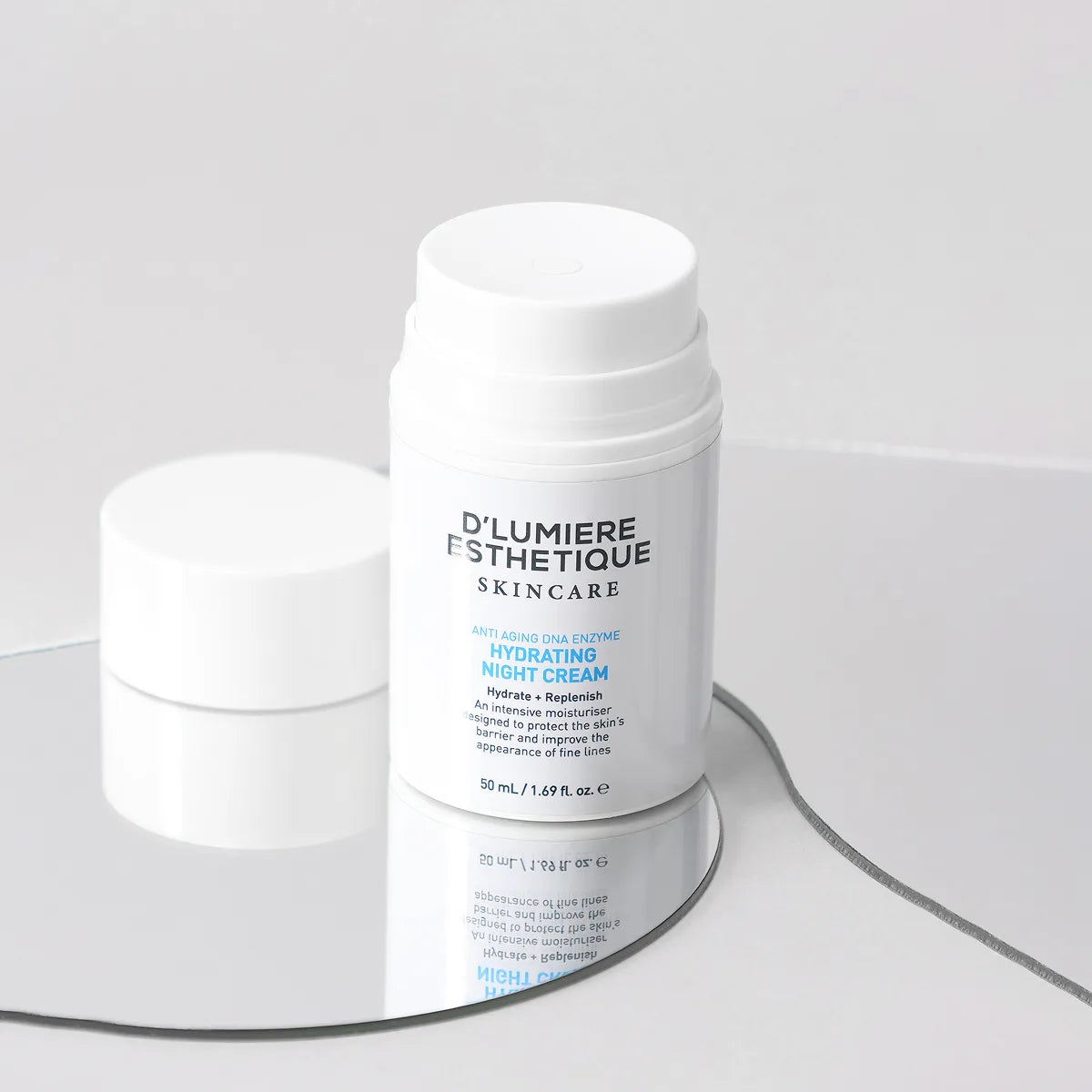 Two skincare cream jars with 'D'Lumiere Esthetique' branding on a gray background
