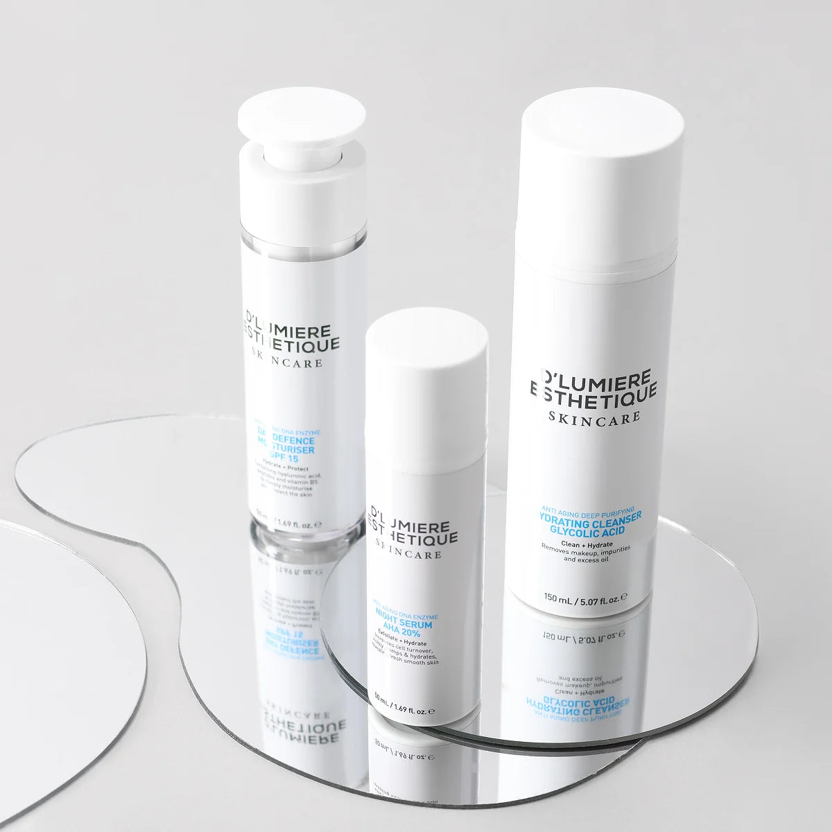 Skincare products on a rotating stand with a neutral background