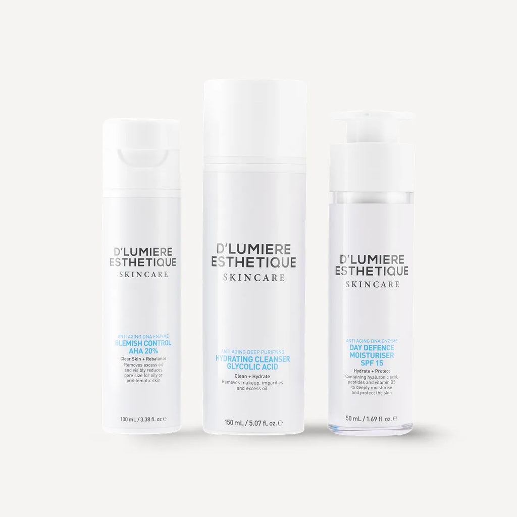 Three bottles of D'Lumiere Esthetique skincare products on a white background