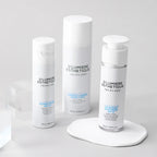 Three skincare products from D'Lumiere Esthetique on a white background